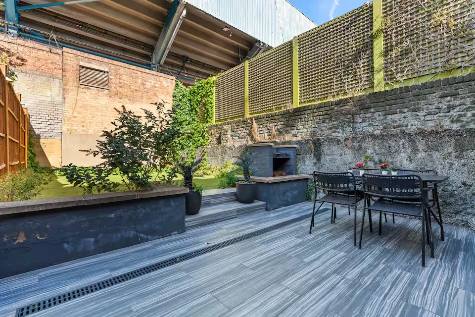 Private landscaped garden at White City Stay